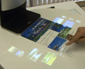 富士通研所が開発する，指で操作する直感型インタフェース